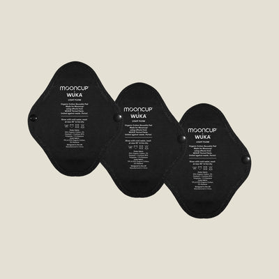 Three WUKA x Mooncup reusable panty liners for light flow, made with GOTS-certified organic cotton and designed for secure, sustainable period care.