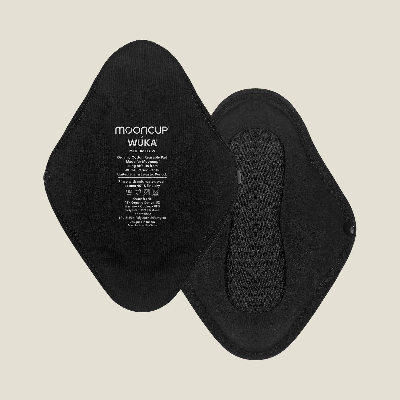 Flat lay of two black reusable period pads for medium flow, showing both front and back sides with snap closures and printed WUKA x Mooncup branding.