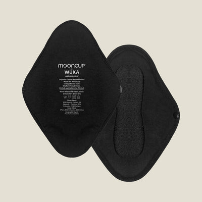 Flat lay of two black reusable period pads for medium flow, showing both front and back sides with snap closures and printed WUKA x Mooncup branding.