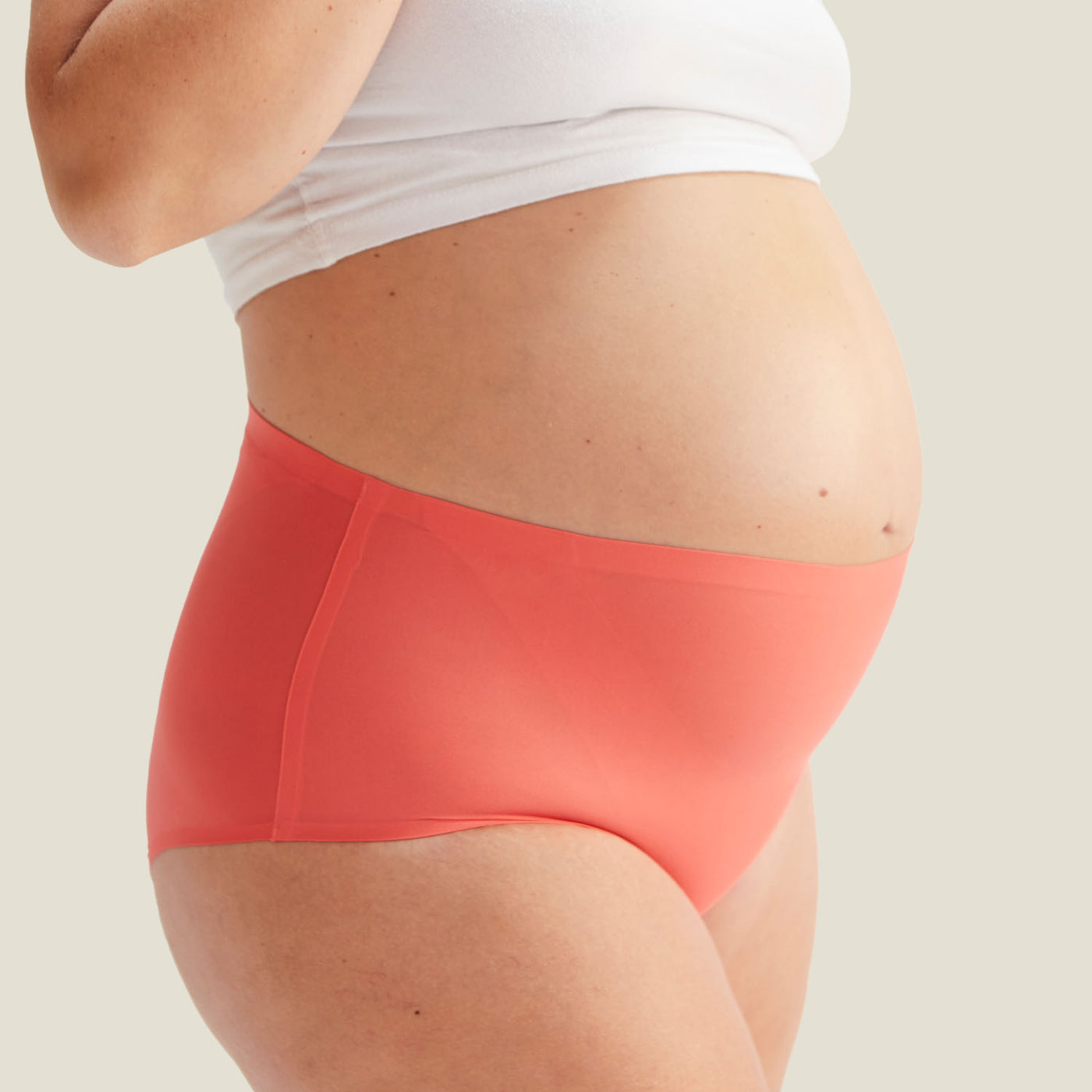 Front view of WUKA Drytech™ High Waist Brief in Coral Pink, offering discreet protection against light incontinence leaks.