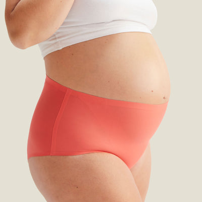 Front view of WUKA Drytech™ High Waist Brief in Coral Pink, offering discreet protection against light incontinence leaks.
