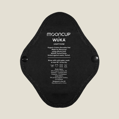 WUKA x Mooncup reusable panty liner for light flow with printed care instructions, made using soft and breathable organic cotton for daily comfort.