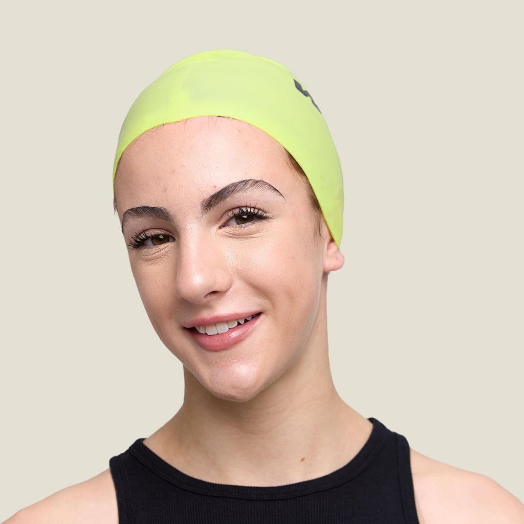 Close-up front view of WUKA lime punch swim cap – soft, water-resistant, and secure fit.