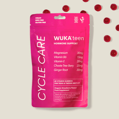 Packaging of WUKA Teen Hormone Support Gummies with ingredients and strawberry gummies shown, ideal hormone support for teens.