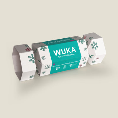 WUKA Cracker Gift Box in white with green and red snowflake prints – a festive, eco-friendly cracker packed with reusable period products.