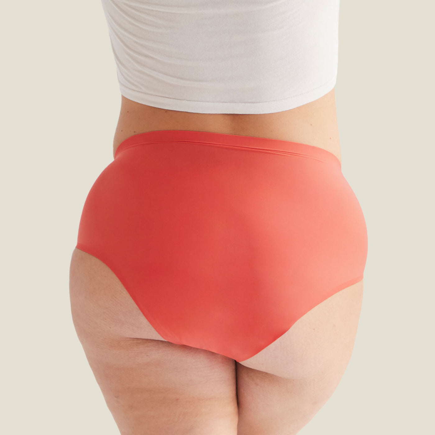 Rear view of Drytech™ High Waist Incontinence Brief in Coral Pink, showing full coverage and seamless design for everyday comfort.