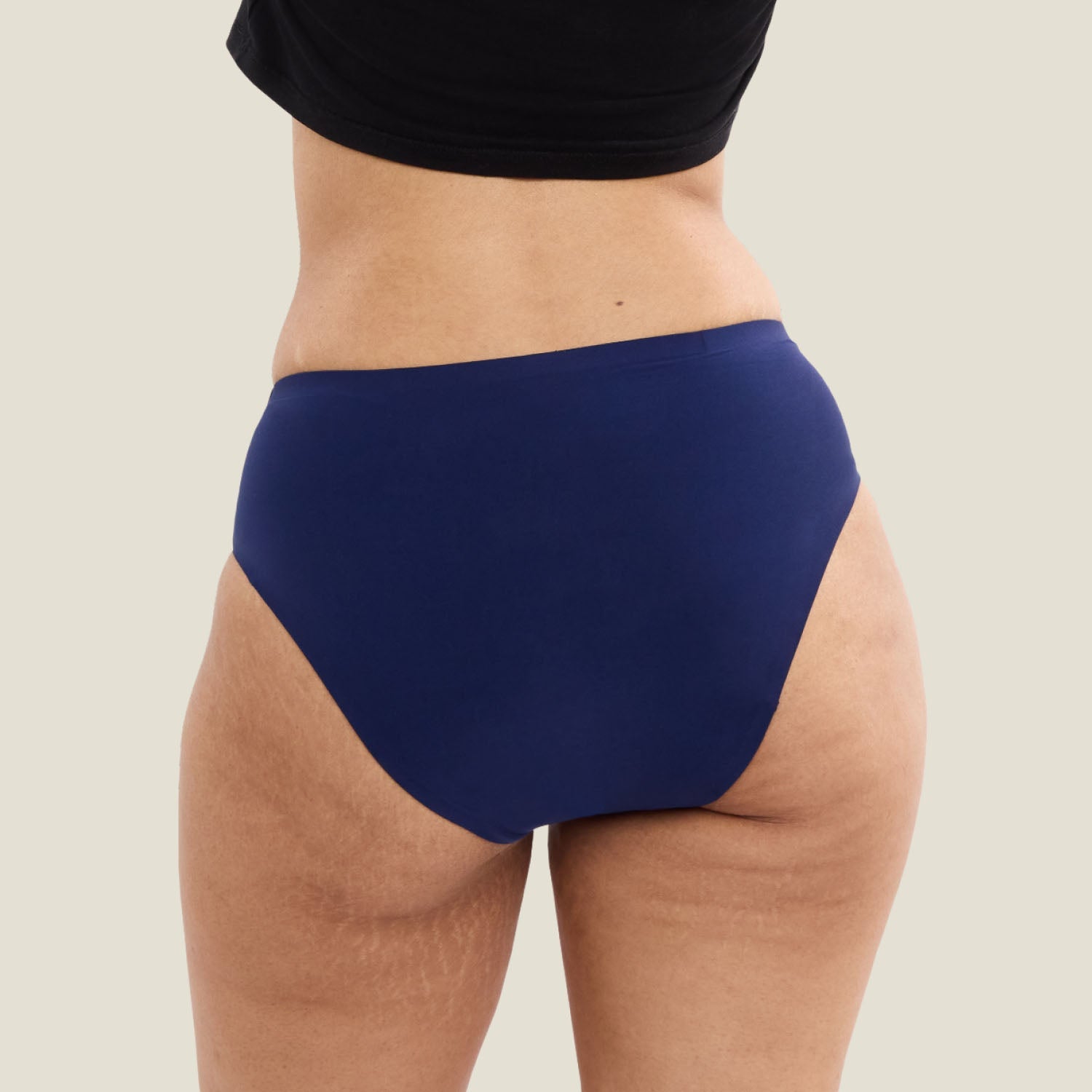 Back view of WUKA Teen Stretch™ Seamless Midi Brief in navy, full coverage teen period pants.