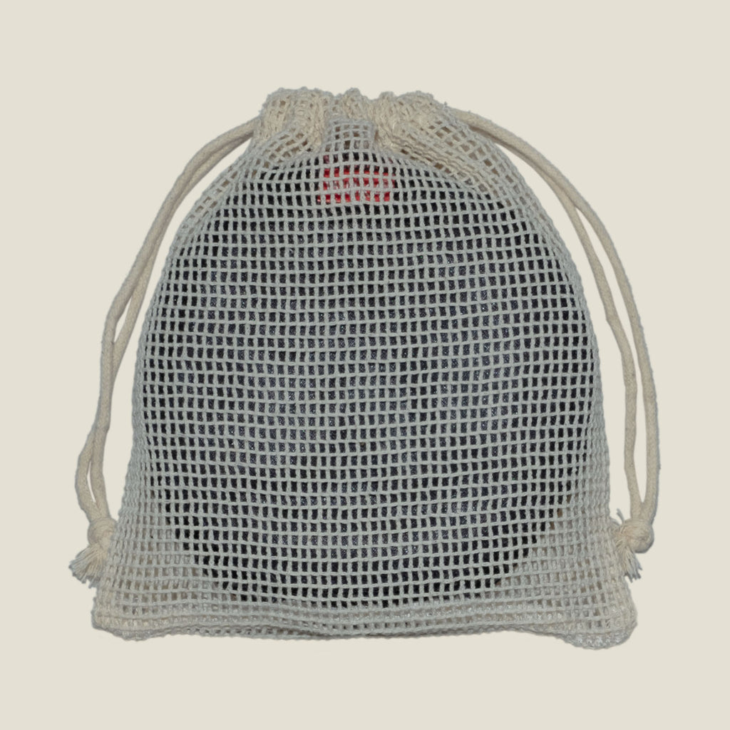 WUKA Nursing Pads neatly packed inside reusable mesh laundry bag, showcasing convenient storage and travel solution.
