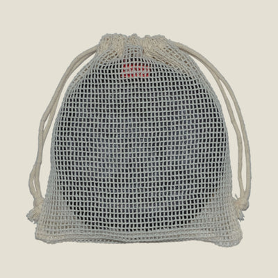 WUKA Nursing Pads neatly packed inside reusable mesh laundry bag, showcasing convenient storage and travel solution.