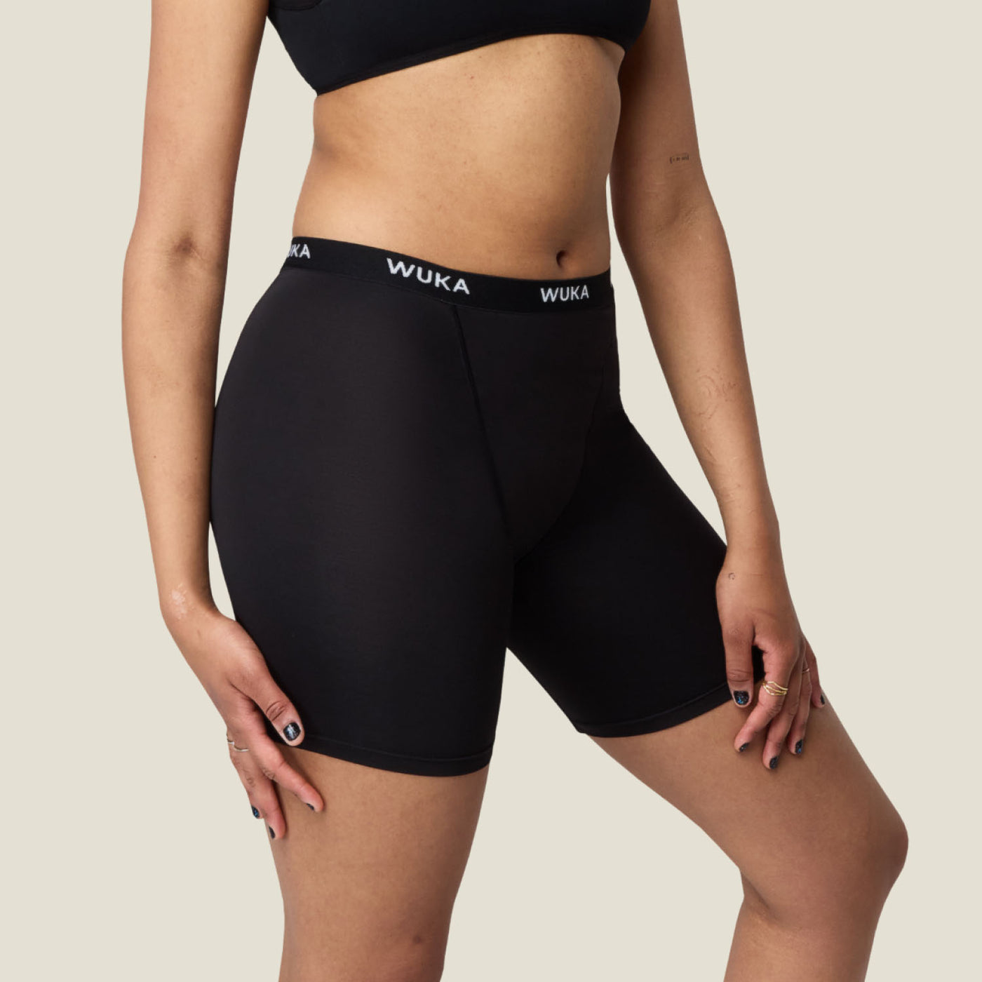 Side profile of WUKA Ultimate™ Boxer Shorts highlighting the mid-thigh length and seamless design for comfort and discretion during menstruation.
