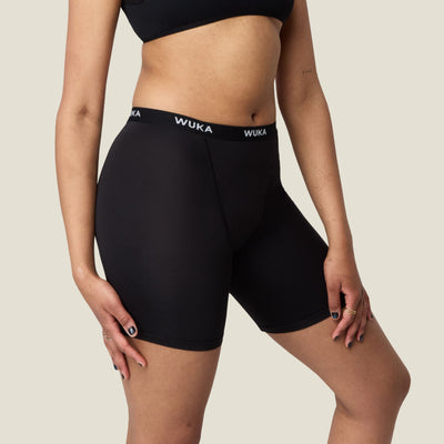 Side profile of WUKA Ultimate™ Boxer Shorts highlighting the mid-thigh length and seamless design for comfort and discretion during menstruation.