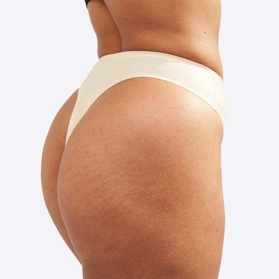 WUKA Stretch Thong Style Light to Medium Absorbency Light Nude Colour Close up Side Size 1