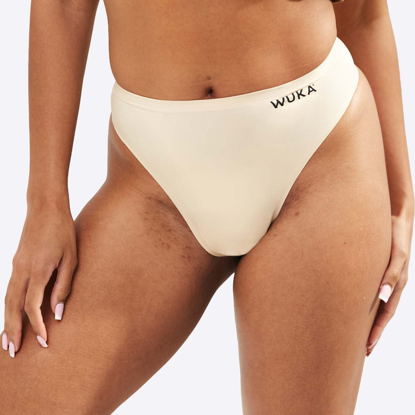 WUKA Stretch Thong Style Light to Medium Absorbency Light Nude Colour Close up Front Size 1