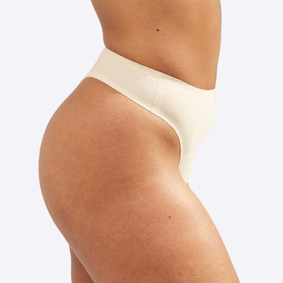 WUKA Stretch Thong Style Light to Medium Absorbency Light Nude Colour Close up Front Side Size 1