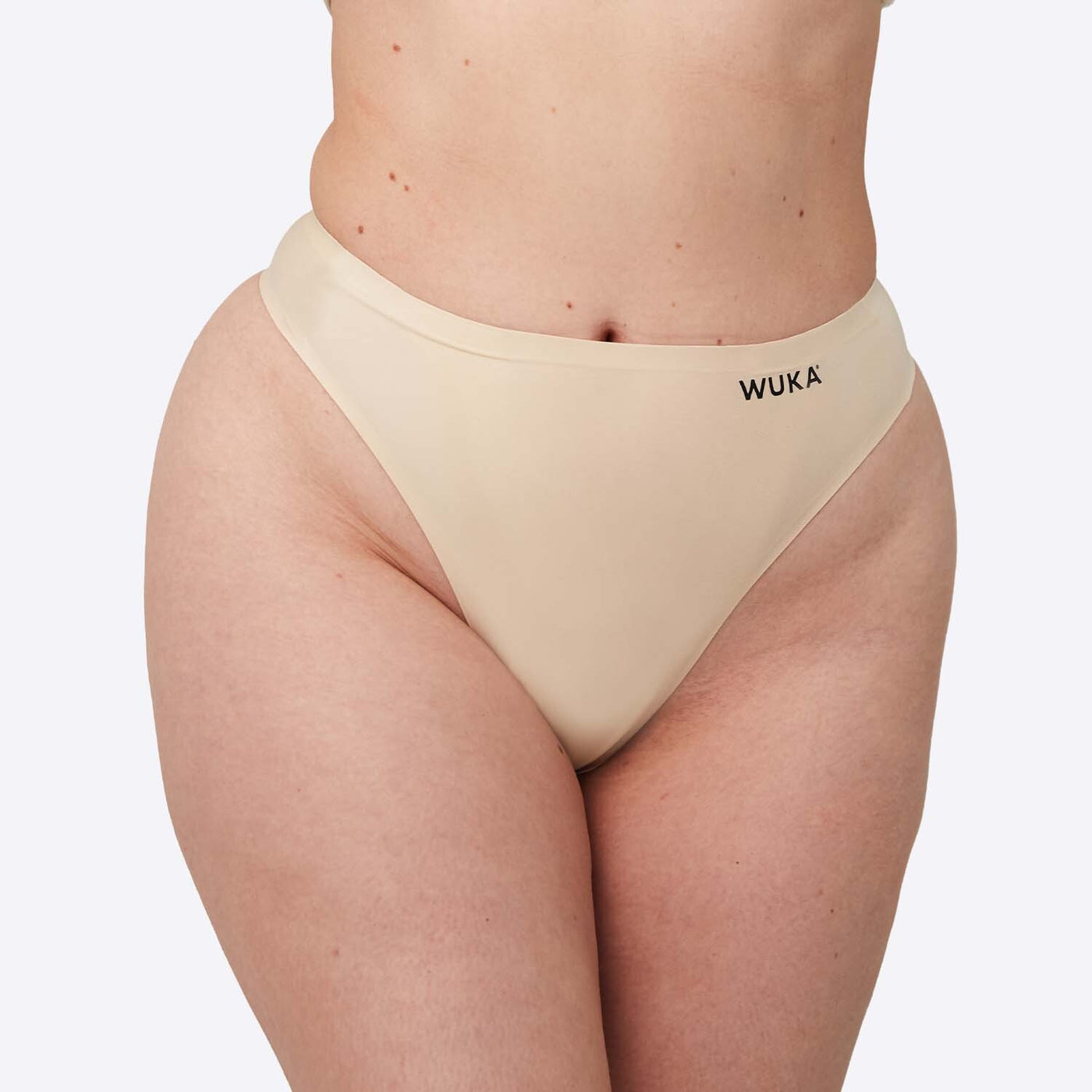 WUKA Stretch Thong Style Light to Medium Absorbency Light Nude Colour Front Size 2