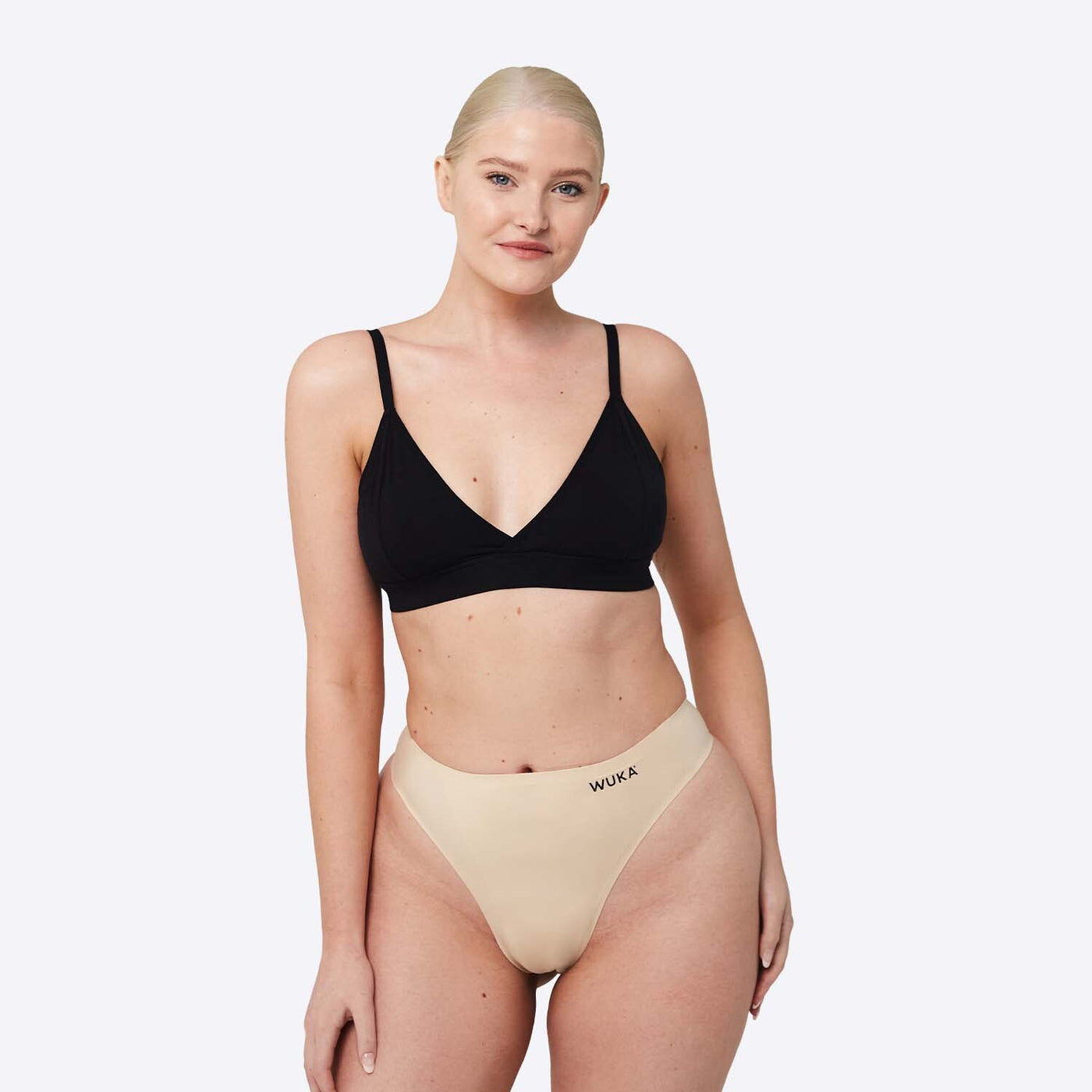 WUKA Stretch Thong Style Light to Medium Absorbency Light Nude Colour Three Quarter Front Size 2